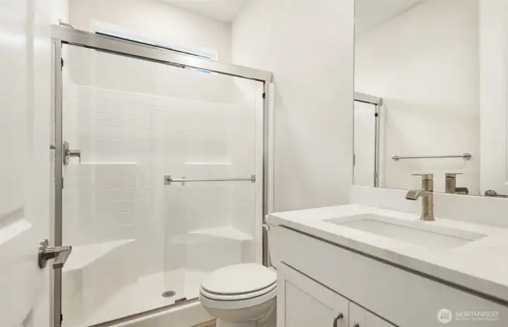 Bathroom to your right, just as you enter