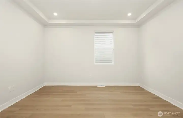 The spacious den with large barn doors to entry