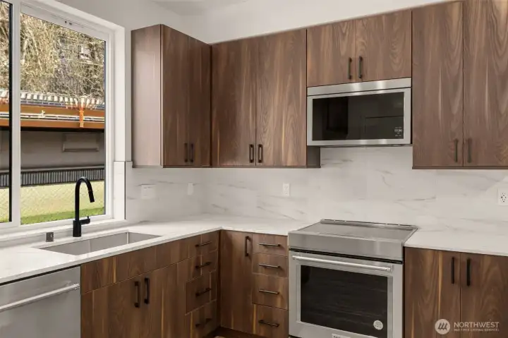 Open-concept living room bathed in natural light from large, oversized windows (virtually staged)