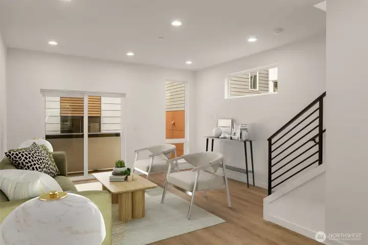 Open-concept living room bathed in natural light from large, oversized windows (virtually staged)