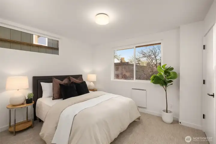bright and airy bedroom with plenty of corner space for a luxury dog bed.