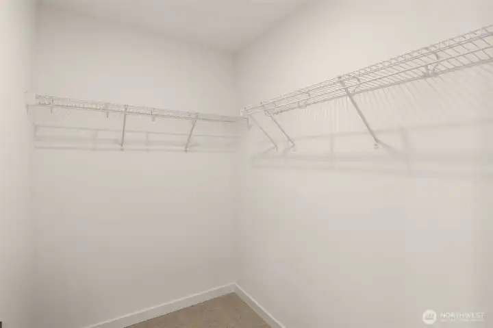 Primary suite contains large walk-in closet