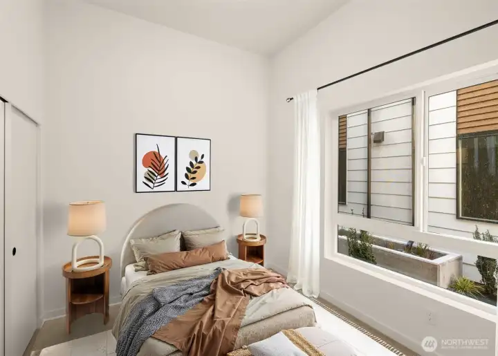 Bright and inviting bedroom with a view of the surrounding neighborhood (virtually staged)