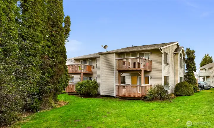 Unit #1 is the lower right unit, recently remodeled, enhancing rental appeal and supporting strong market rents.  All 4 units feature private back decks that overlook greenery and landscaped space rather than neighboring buildings — a valuable tenant amenity that adds a sense of privacy, improves livability, and supports long-term tenant retention.