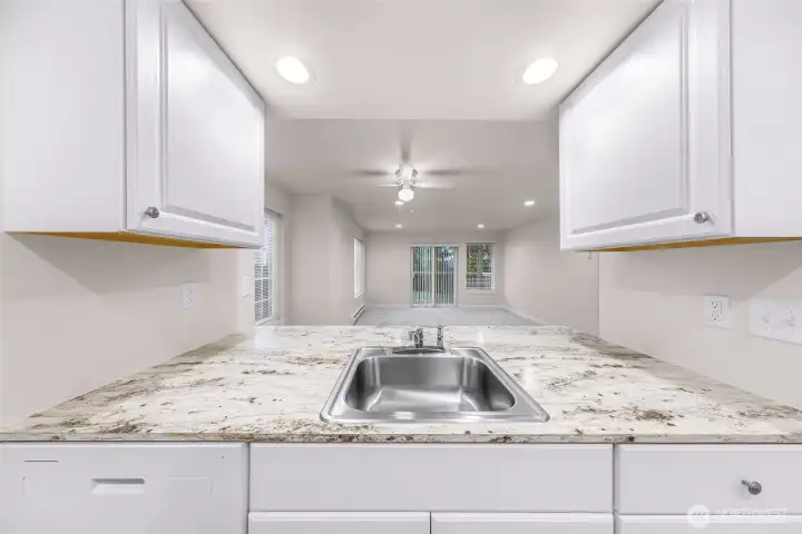 View from Unit #1 kitchen to living room slider (new as well)