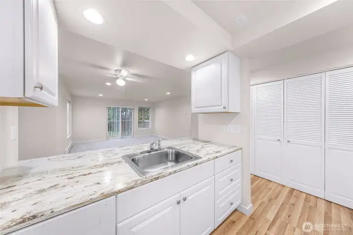 Kitchen of Unit #1 - Notice the closed closet doors to your right where the Washer/Dryer and hot water tank are.