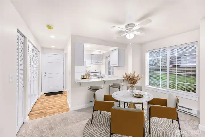 Virtually staged Unit #1 - Entry, kitchen, dining area