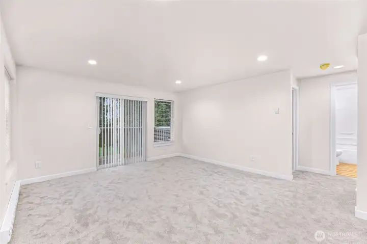 Unit #1 - Living room & deck (left) & bathroom (right)