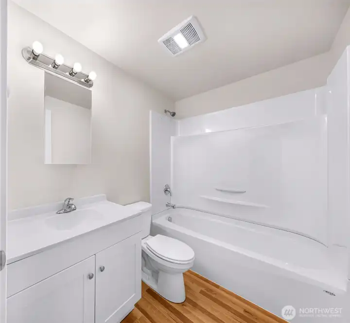 Unit #1 - Brand new bathroom!  Tub/shower, toilet, sink/vanity, lighting & flooring - a strong value-add component already executed for the next owner.