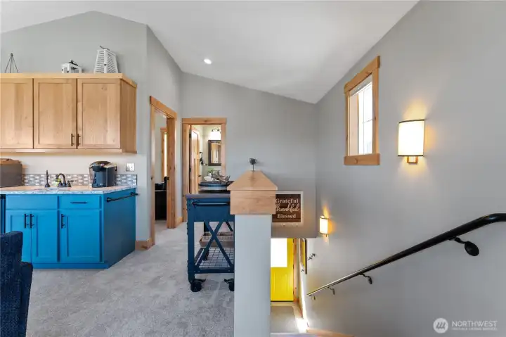 Carriage House - Staircase and view of kitchenette.