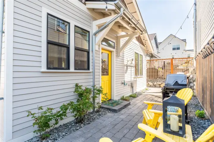 Daytime view of West facing outdoor patio and living area.