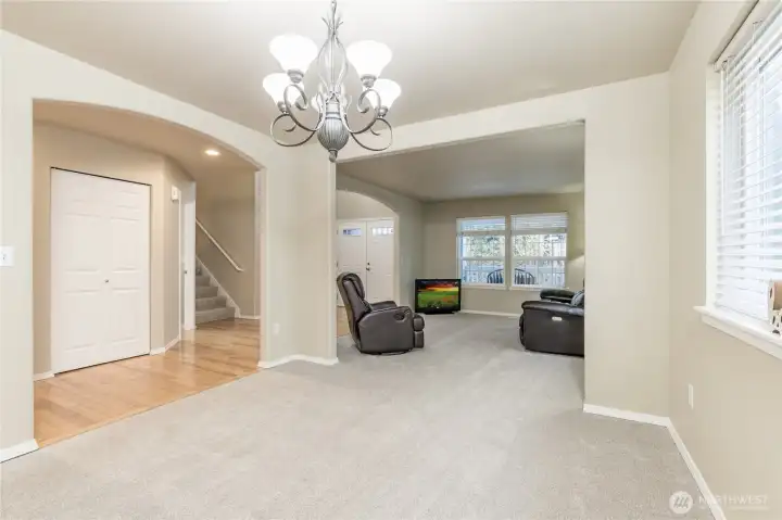 Spacious dining room, looking toward entrance. New carpet in 2025!