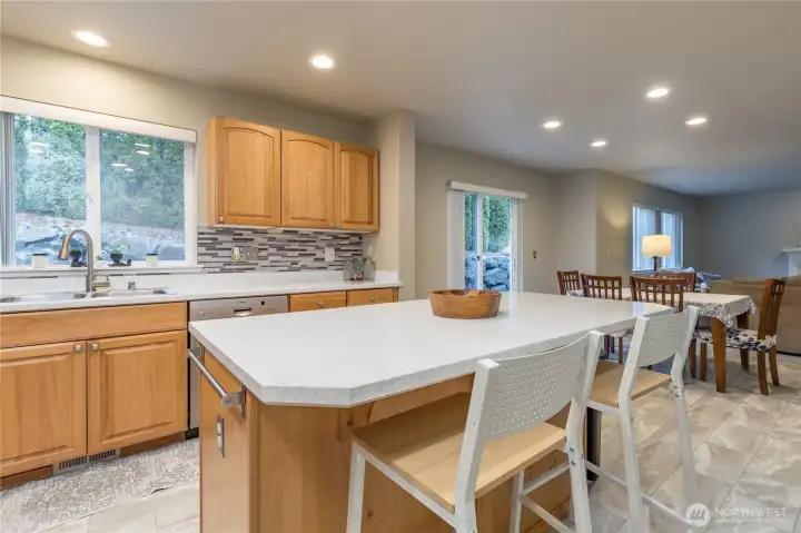 Convenient island for additional prep space and counter seating