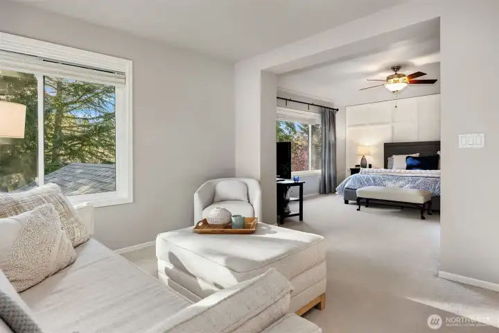 Primary sitting room looking into the bedroom.