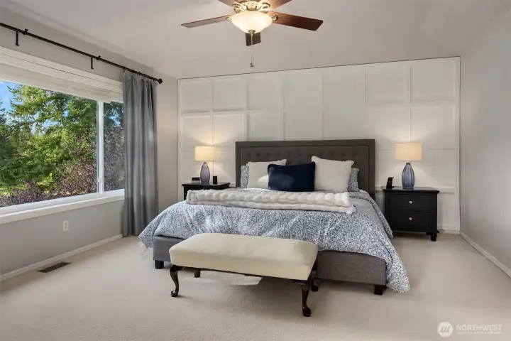 Primary bedroom overlooks the backyard.