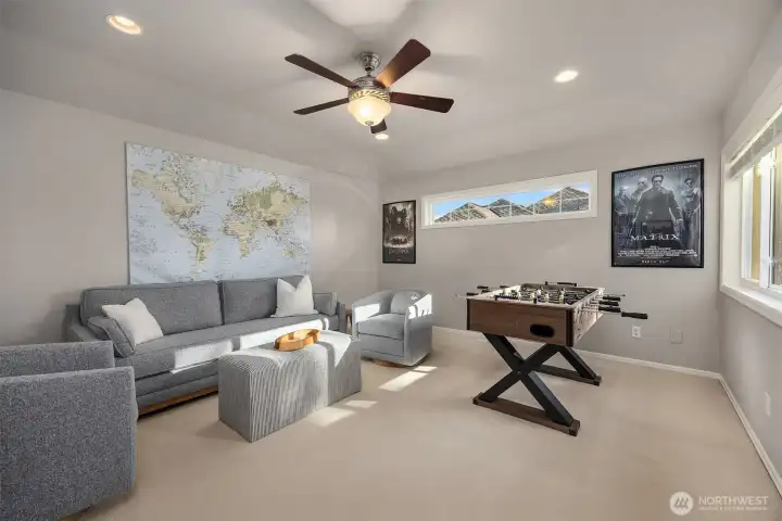 The 4th bedroom is currently being used as a media-game room.