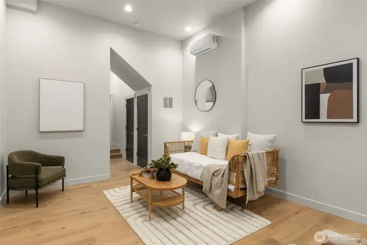 Welcoming entry level featuring a versatile guest suite with a full bed and bath.