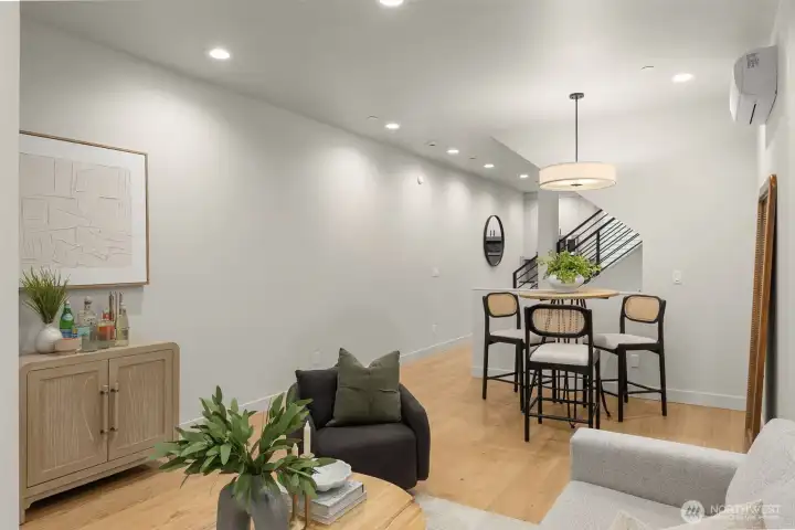 The open-concept design flows effortlessly from the kitchen to the dining area, ideal for modern living.