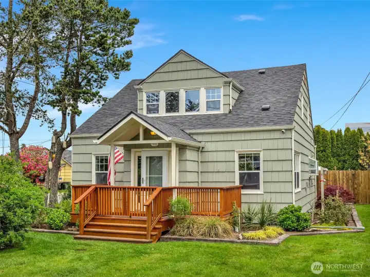Charming 1937 Craftsman exterior in Seaview with covered front porch and mature landscaping