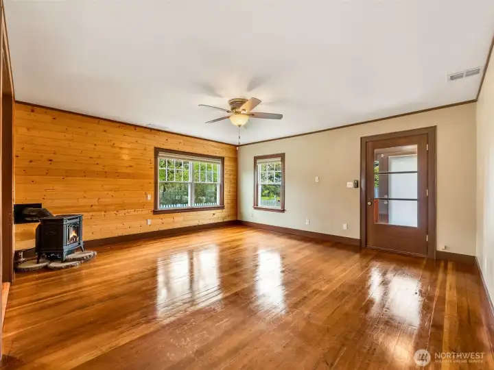 Spacious main living area with warm wood tones and natural light