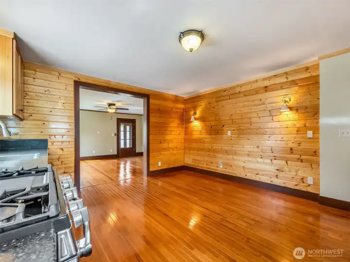 Dining area within the kitchen and hardwood flooring