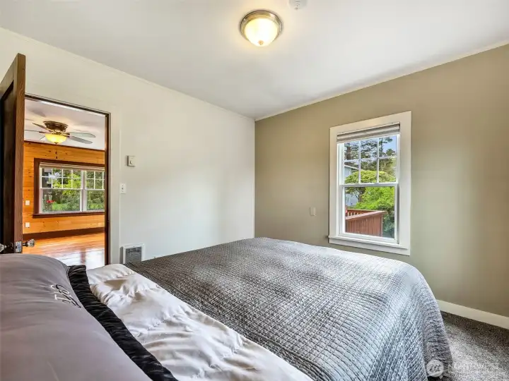 Main level bedroom with natural light and neutral tones