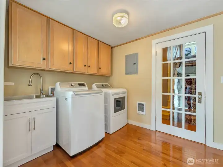 Dedicated laundry and mud room with exterior access