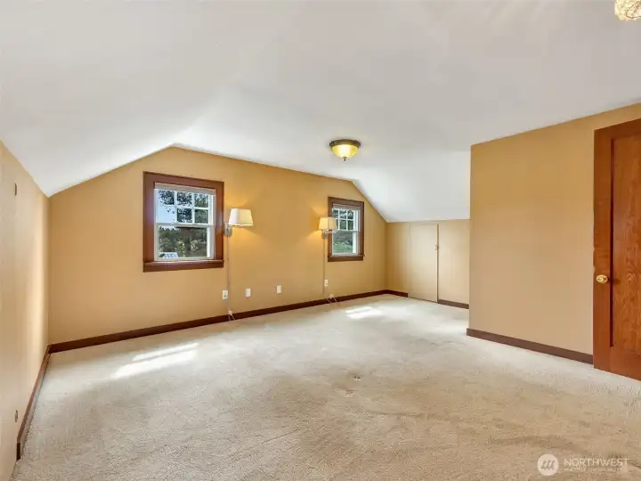 Upstairs bedroom with potential for primary suite conversion