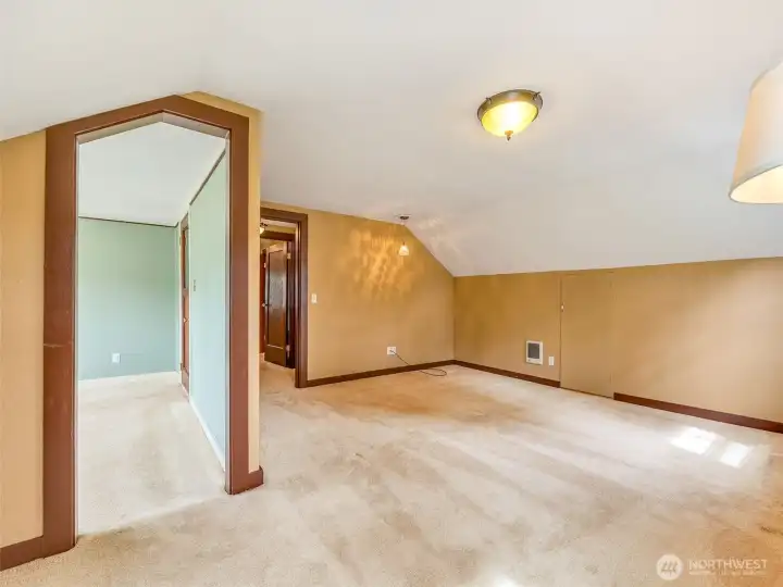 Upstairs bedroom with potential for primary suite conversion