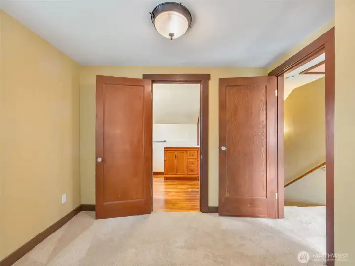 Upstairs bedroom or walk-in closet option connected to primary bath