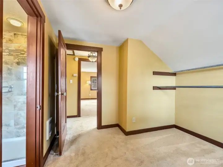 Upstairs bedroom or walk-in closet option connected to primary bath