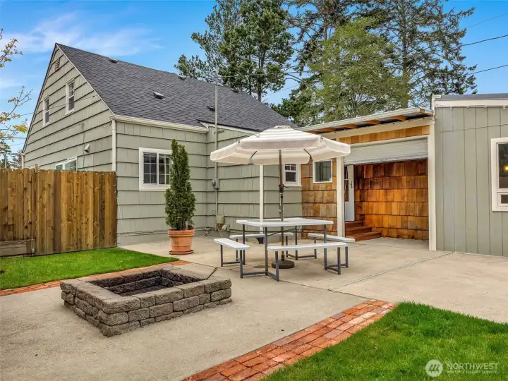 Outdoor patio and fire pit area perfect for entertaining and relaxing