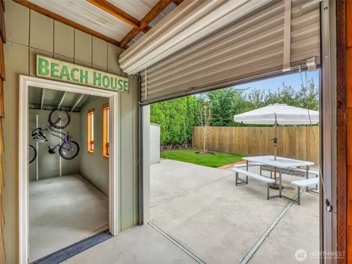 Covered walkway and storm door connecting home to garage for year-round convenience