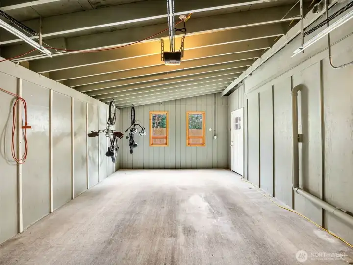 1 of 2 attached single car garages. could be used for parking, storage or a work space.