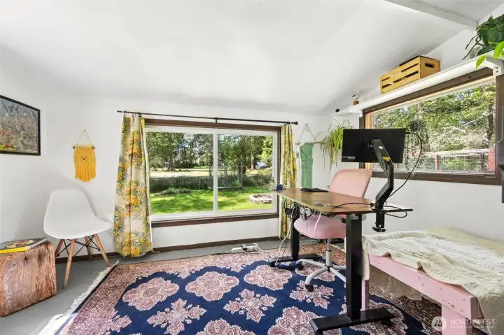 Currently used as a home office, but it would make a great studio for painting, yoga and crafts. Lots of light and a walkout to the back yard, with pet door.