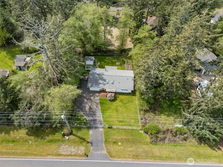 Paved driveway and fully fenced.