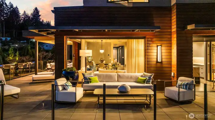 The great room features 3 sets of Fleetwood pocket doors allowing the walls to fully open and bring the outdoors in.