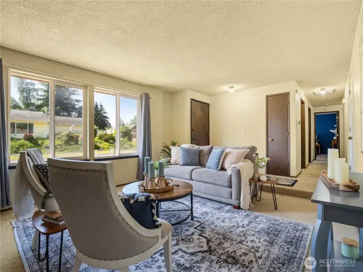 Large windows let tons of natural light in and brighten the space. Large windows let tons of natural light in and brighten the space.