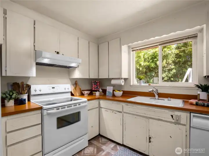 Doing dishes is a breeze with a view of the back yard. Doing dishes is a breeze with a view of the back yard.