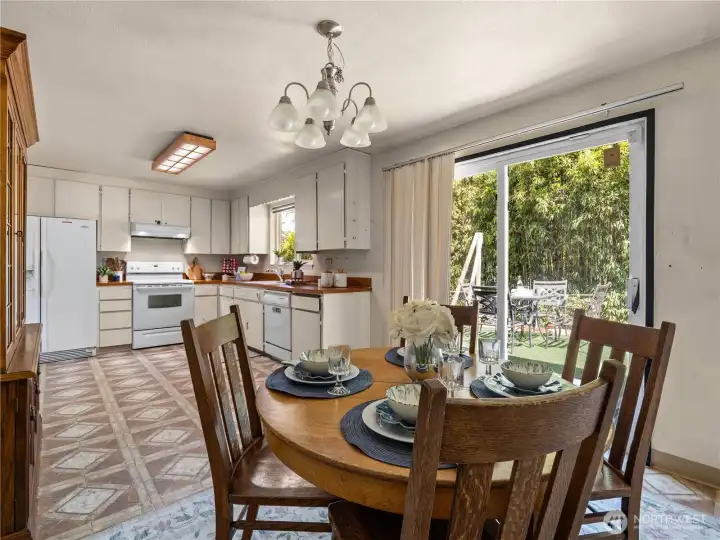 This kitchen has a dining area and a lot of space. Maybe add a floating island for more workspace and storage? This kitchen has a dining area and a lot of space. Maybe add a floating island for more workspace and storage?