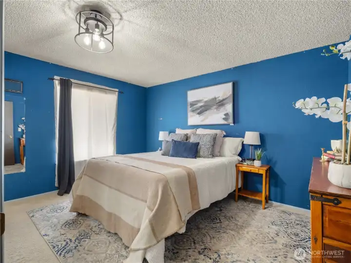 The primary bedroom with an on suite. The primary bedroom with an on suite.