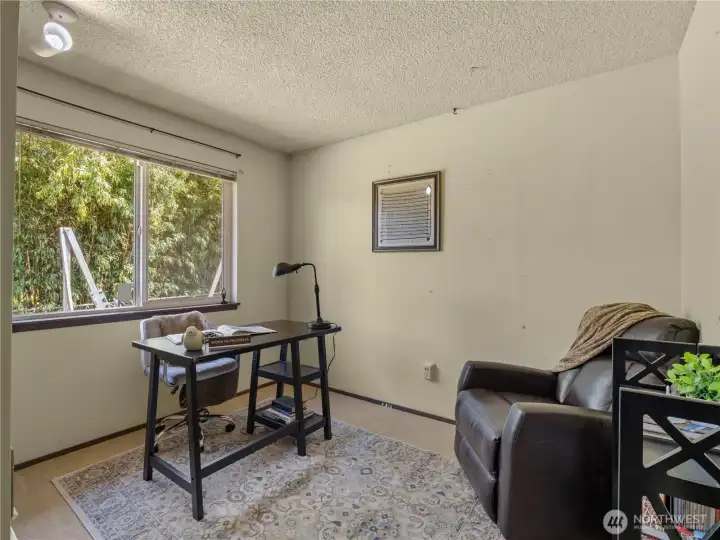 The third bedroom, here staged as an office has a view of the back yard. The third bedroom, here staged as an office has a view of the back yard.