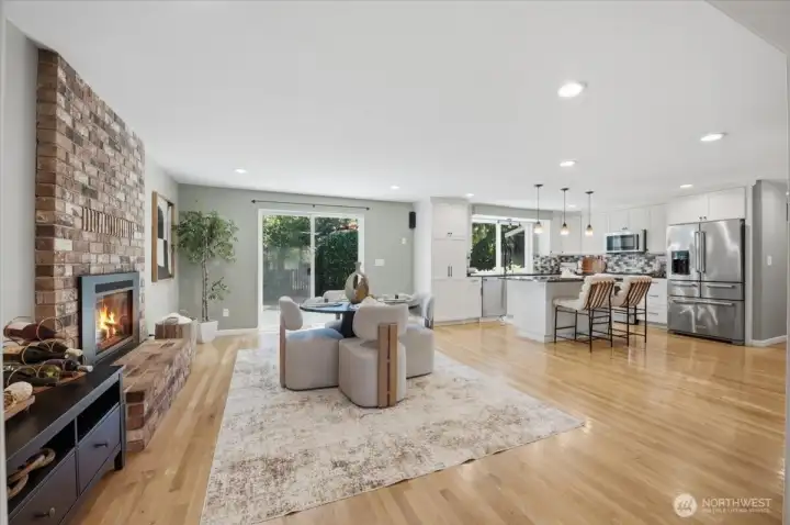 Open concept kitchen and dining with gas fireplace
