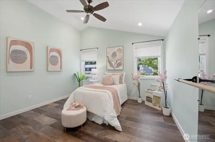 beautiful bedroom with vaulted ceiling.