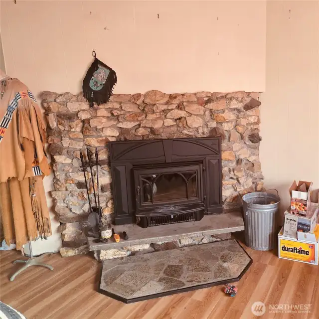 Main floor living room with wood burning stove will comfortably heat entire living/kitchen area
