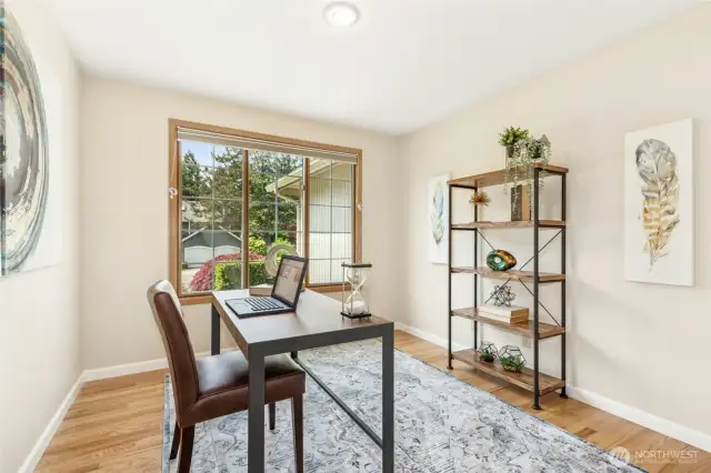 A main floor den offers a closet and easily converts to a fourth bedroom.