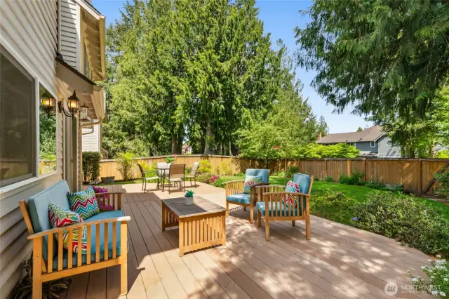 A lovely backyard setting is set amongst mature lush landscape, creating a private backyard oasis, offering an entertainment sized deck and fire pit area for gatherings.