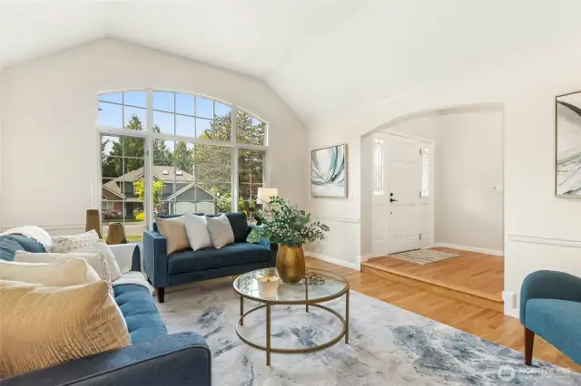 Another angle looking towards the entry. Note the vaulted ceiling and fine chair rail finish work.
