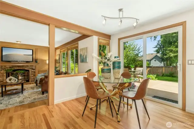 Informal eating area with a slider to the backyard. Note the newly refinished hardwood floors.