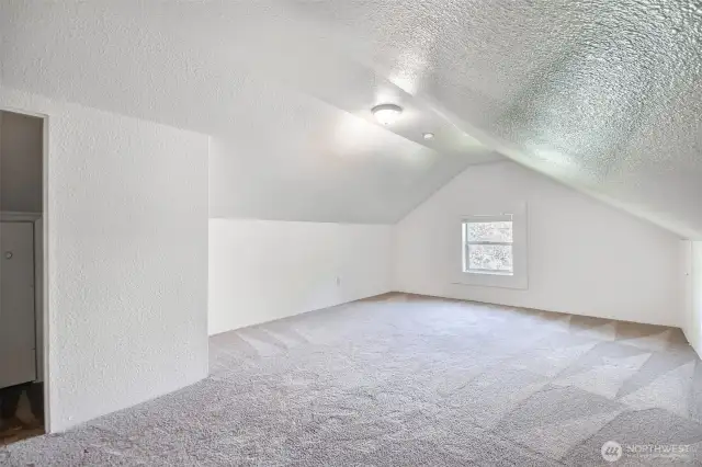 Generous upstairs bedroom with room to stretch out and wind down
